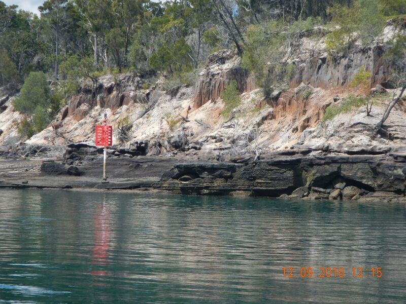 A steeply sloping low (wave) energy shoreline of coffee rock beneath sand, along the coast of K’gari (Fraser Island) within the Great Sandy Strait. Riverine and strong tidal current flows have undercut the steep banks such that the softer, intermediately consolidated coffee rocks tumble down, forming boulder fields subtidally. Photo by Maria Zann