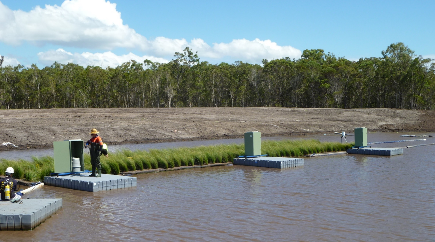 Figure 2 Floating wetland with water quality samplers. Photo by SPEL