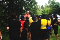 Children getting ready for canoe trip and listerning to the teacher